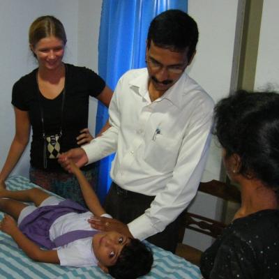A Projects Abroad intern watches over a local doctor and assist him whilst on his physiotherapy internship in Sri Lanka. A Projects Abroad intern is pictured watching over a doctor as part of their physiotherapy internship in Sri Lanka.